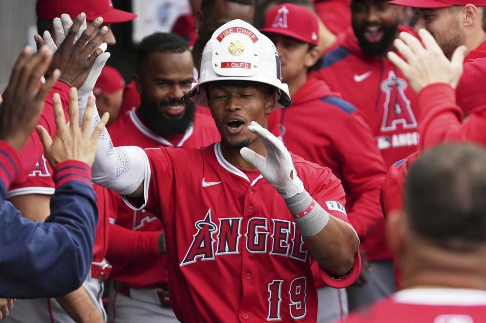Los Angeles Angels' Kyren Paris celebrates with teammates after hitting a solo home run during the eighth inning of a baseball game against the Chicago White Sox in Chicago, Sunday, March 30, 2025. (AP Photo/Nam Y. Huh)
