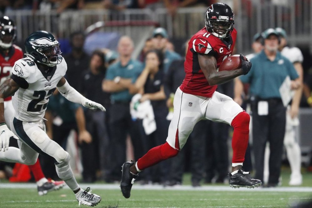 FILE - Atlanta Falcons wide receiver Julio Jones (11) runs toward the end zone for a touchdown against Philadelphia Eagles free safety Rodney McLeod (23) during the second half of an NFL football game, Sunday, Sept. 15, 2019, in Atlanta. (AP Photo/John Bazemore, File)