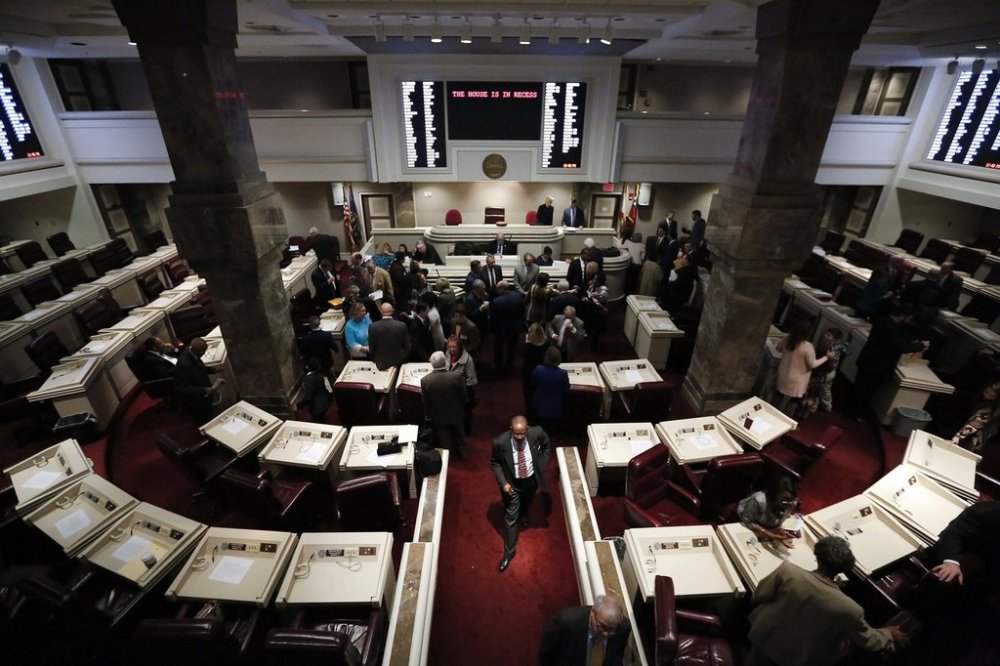 FILE - Alabama State Representatives walk through the Statehouse as the Alabama legislative session begins, Tuesday, Jan. 9, 2018, in Montgomery, Ala. (AP Photo/Brynn Anderson, file)