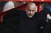 Manchester City's head coach Pep Guardiola arrives the bench prior to the English Premier League soccer match between Nottingham Forest and Manchester City at the City Ground stadium in Nottingham, England, Saturday, March 8, 2025. (AP Photo/Rui Vieira)