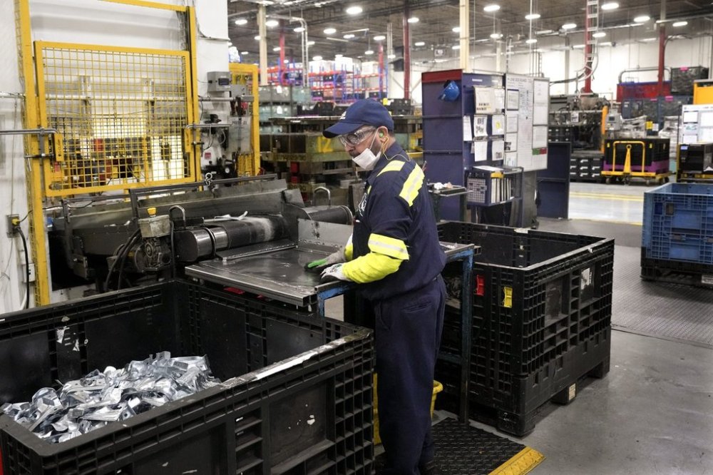 An employee works on the production line at the Martinrea auto parts manufacturing plant in Woodbridge, Ont., on Monday Feb. 3, 2025. The site supplies auto parts to both Canadian and U.S. auto plants. THE CANADIAN PRESS/Chris Young