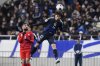 Japan's Ao Tanaka reaches for a header during the World Cup qualifying soccer match between Japan and Bahrain at Saitama Stadium in Saitama, Japan, Thursday, March 20, 2025. (AP Photo/Eugene Hoshiko)