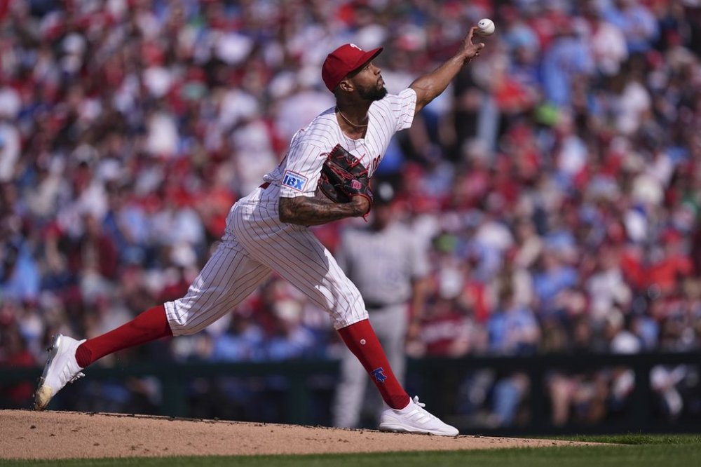 Philadelphia Phillies' Cristopher Sánchez pitches during the second inning of the team's home-opener baseball game against the Colorado Rockies, Monday, March 31, 2025, in Philadelphia. (AP Photo/Matt Rourke)