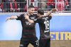 Berlin's Andrej Ilic, left, and Josip Juranovic celebrate after scoring their side's second goal during the German Bundesliga soccer match between SC Freiburg - 1. FC Union Berlin at The Europa-Park Stadion in Freiburg, Germany, Sunday, March 30, 2025. (Harry Langer/dpa via AP)