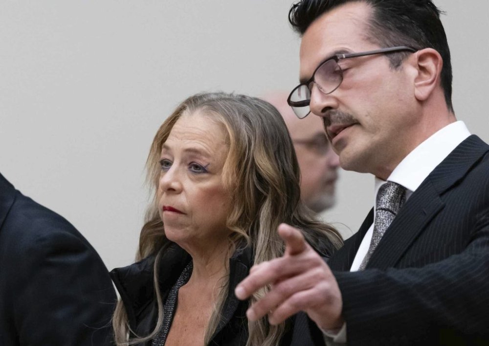 Kim Sullivan who is charged with neglect, stands with her attorney Ioannis Kaloidis, right, during her arraignment Wednesday, March 12, 2025 at Waterbury Superior Court in Waterbury, Conn. (Jim Shannon/Hearst Connecticut Media via AP, Pool)