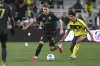 Portland Timbers defender Ian Smith (23) moves the ball as Nashville SC defender Andy Najar, right, defends during the first half of an MLS soccer match Saturday, March 8, 2025, in Nashville, Tenn. (AP Photo/John Amis)