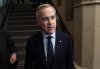 Liberal Leader Mark Carney speaks briefly with media as he makes his way to a caucus meeting on Monday, March 10, 2025 in Ottawa. Carney met with Ontario Premier Doug Ford this morning, ahead of the provincial leader's trip to Washington, D.C., to discuss tariffs and free trade with a top U.S. official. THE CANADIAN PRESS/Adrian Wyld