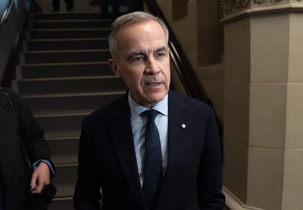 Liberal Leader Mark Carney speaks briefly with media as he makes his way to a caucus meeting on Monday, March 10, 2025 in Ottawa. Carney met with Ontario Premier Doug Ford this morning, ahead of the provincial leader's trip to Washington, D.C., to discuss tariffs and free trade with a top U.S. official. THE CANADIAN PRESS/Adrian Wyld