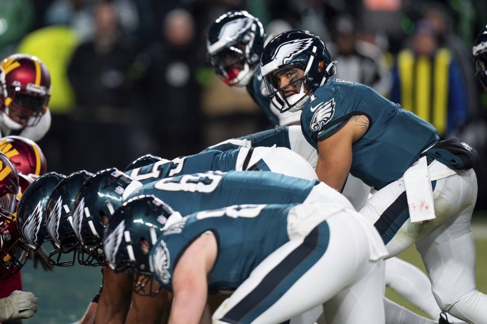 FILE - Philadelphia Eagles quarterback Jalen Hurts (1) lines up for the goal line Tush Push play during the NFL championship playoff football game against the Washington Commanders, Jan. 26, 2025, in Philadelphia. (AP Photo/Chris Szagola, File)