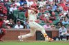 St. Louis Cardinals' Lars Nootbaar, right, hits a two RBI single during the sixth inning of a baseball game against the Minnesota Twins, Saturday, March 29, 2025, in St. Louis. (AP Photo/Michael Thomas)