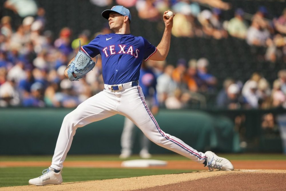 Texas Rangers starting pitcher Cody Bradford throws against the Chicago Cubs during the first inning of a spring training baseball game Friday, Feb. 28, 2025, in Surprise, Ariz. (AP Photo/Lindsey Wasson)