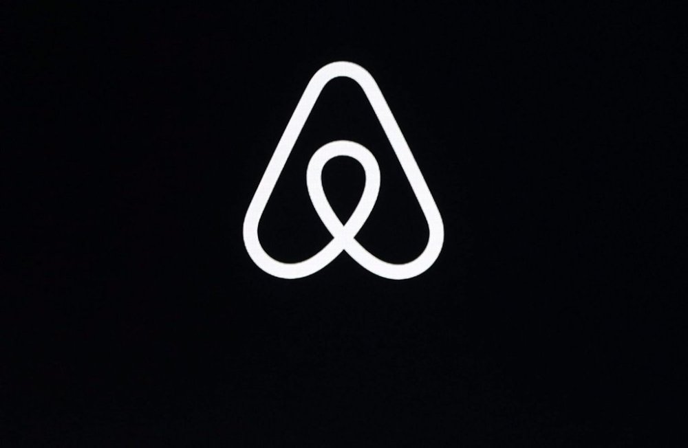 This Feb. 22, 2018, file photo shows an Airbnb logo during an event in San Francisco. THE CANADIAN PRESS/AP-Eric Risberg