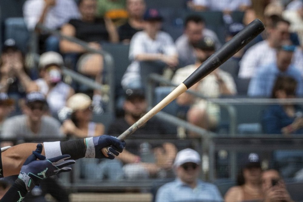 New York Yankees' Aaron Judge hits a home run with one of the team's newly-made torpedo-shaped bats in a baseball game against the Milwaukee Brewers, Saturday, March 29, 2025, in New York. (AP Photo/Angelina Katsanis)