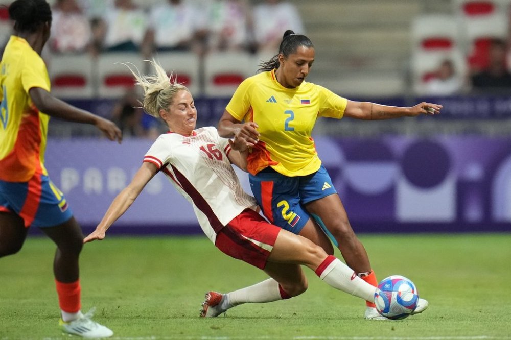 Canada's Janine Sonis, left, fouls Colombia's Manuela Vanegas during a women's Group A soccer match between Colombia and Canada, at the 2024 Summer Olympics, Wednesday, July 31, 2024, at the Nice Stadium in Nice, France. Canada will host Argentina in B.C. in a pair of women's international soccer friendlies during the April FIFA international window. THE CANADIAN PRESS/AP-Julio Cortez