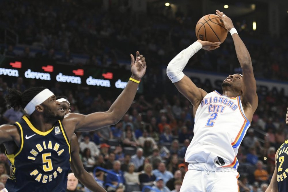 Oklahoma City Thunder guard Shai Gilgeous-Alexander (2) shoots over Indiana Pacers forward Jarace Walker (5) during the first half of an NBA basketball game, Saturday, March 29, 2025, in Oklahoma City. (AP Photo/Kyle Phillips)