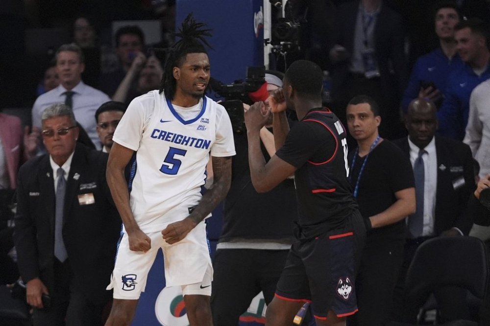 Creighton's Jamiya Neal (5) exchanges words with UConn's Hassan Diarra (10) during the second half of an NCAA college basketball game in the semifinals of the Big East tournament Friday, March 14, 2025, in New York. (AP Photo/Frank Franklin II)