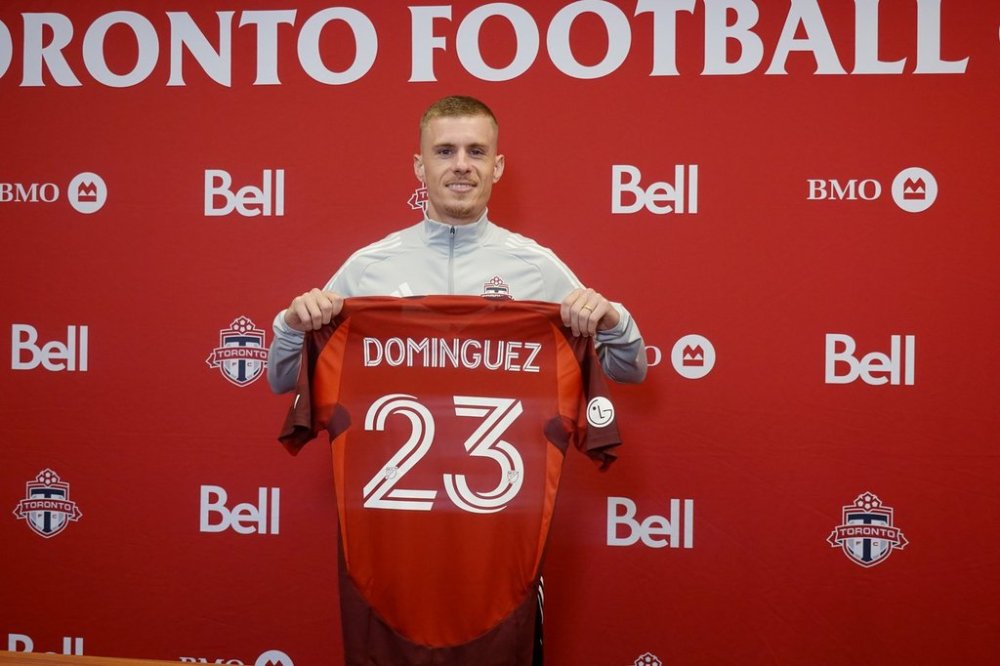 Newly signed Swiss-Spanish midfielder Maxime Dominguez poses with his Toronto FC jersey on Friday April 4, 2025, at the MLS club's north Toronto training centre. THE CANADIAN PRESS/Neil Davidson