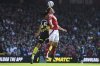 Nottingham Forest's Chris Wood, front, and Manchester City's Abdukodir Khusanov compete for the ball during the English Premier League soccer match between Nottingham Forest and Manchester City at the City Ground stadium, in Nottingham, England, Saturday, March 8, 2025. (AP Photo/Rui Vieira)