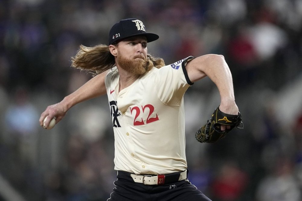 FILE - Texas Rangers starting pitcher Jon Gray throws to the Oakland Athletics in the first inning of a baseball game, Friday, Aug. 30, 2024, in Arlington, Texas. (AP Photo/Tony Gutierrez, File)