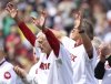 Former Boston Red Sox outfielder Carl Yastrzemski, left, and catcher Carlton Fisk acknowledge fans as they walk onto the field prior to a home-opener baseball game against the St. Louis Cardinals, Friday, April 4, 2025, in Boston. (AP Photo/Mark Stockwell)