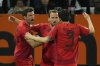 Bayern's Thomas Mueller, left, Harry Kane, center, and Kim Min-jae celebrate after a goal during the German Bundesliga soccer match between Augsburg and Bayern Munich in Augsburg, Friday, April 4, 2025. (AP Photo/Matthias Schrader)
