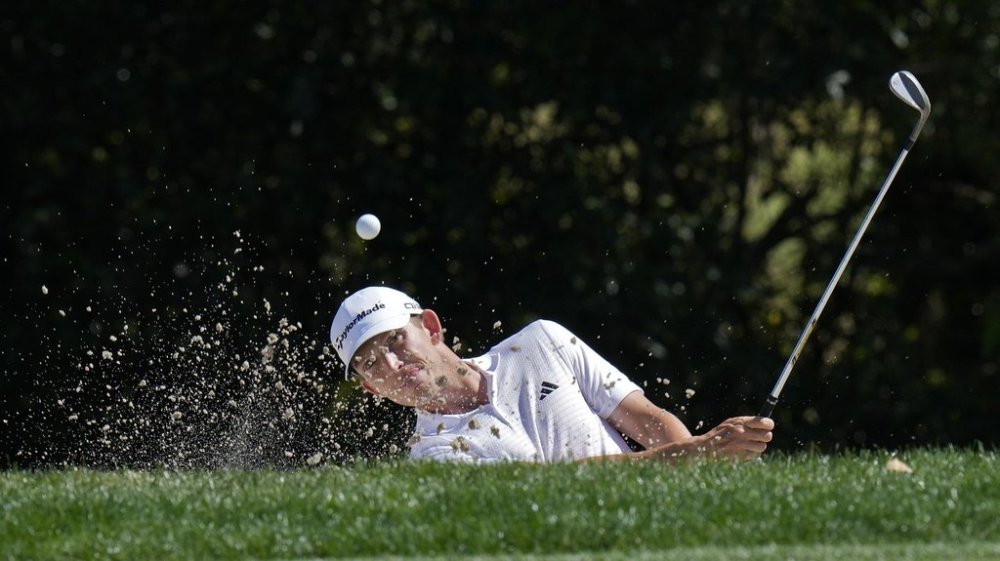 Jacob Bridgeman blasts from a sand trap on the seventh hole during the first round of the Valspar Championship golf tournament Thursday, March 20, 2025, at Innisbrook in Palm Harbor, Fla. (AP Photo/Chris O'Meara)