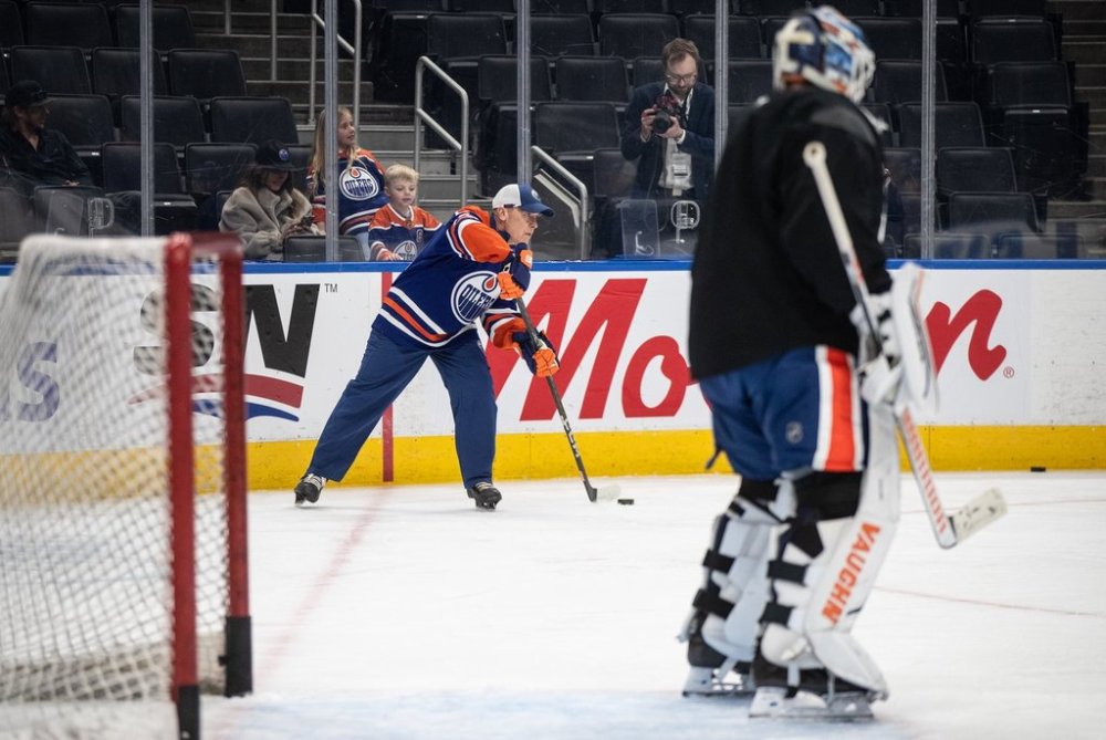 Prime Minister Mark Carney skates with the Edmonton Oilers during a visit to Edmonton on Thursday, March 20, 2025. THE CANADIAN PRESS/Jason Franson