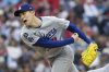 Los Angeles Dodgers starting pitcher Roki Sasaki throws during the first inning of a baseball game against the Philadelphia Phillies, Saturday, April 5, 2025, in Philadelphia. (AP Photo/Laurence Kesterson)