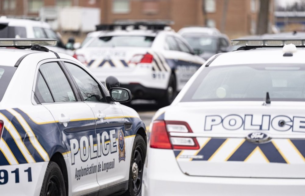 Longueuil police vehicles are parked in Longueuil, Que. Monday, March 4, 2024. THE CANADIAN PRESS/Christinne Muschi