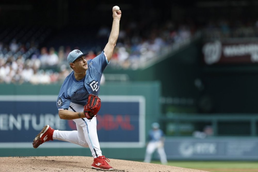 Washington Nationals pitcher Mitchell Parker throws during the first inning of a baseball game against the Philadelphia Phillies in Washington, Sunday, March 30, 2025. (AP Photo/Terrance Williams)
