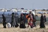 FILE - Displaced Palestinians arrive in Khan Younis, Gaza, on Sunday, March 23, 2025. (AP Photo/Abdel Kareem Hana, File)