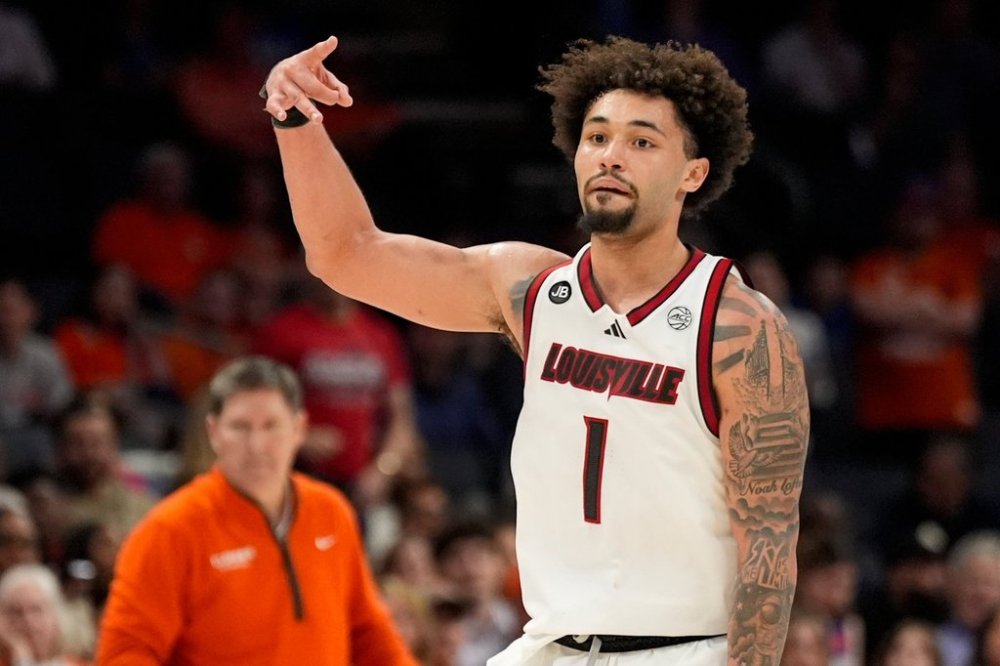 FILE - Louisville guard J'Vonne Hadley celebrates after scoring against the Clemson during the second half of an NCAA college basketball game in the semifinals of the Atlantic Coast Conference tournament, Saturday, March 15, 2025, in Charlotte, N.C. (AP Photo/Chris Carlson, File)