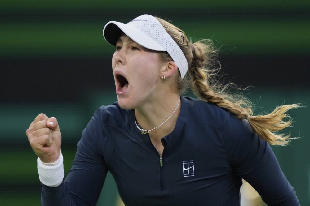 Mirra Andreeva, of Russia, celebrates winning a point against Iga Swiatek, of Poland, during the semifinals at the BNP Paribas Open tennis tournament Friday, March 14, 2025, in Indian Wells, Calif. (AP Photo/Mark J. Terrill)
