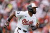 Baltimore Orioles' Cedric Mullins advances toward first base after hitting a two-run RBI double during the first inning of an opening-day baseball game against the Boston Red Sox, Monday, March 31, 2025, in Baltimore. (AP Photo/Stephanie Scarbrough)