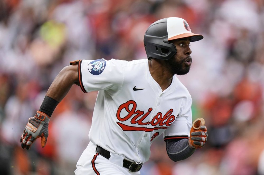 Baltimore Orioles' Cedric Mullins advances toward first base after hitting a two-run RBI double during the first inning of an opening-day baseball game against the Boston Red Sox, Monday, March 31, 2025, in Baltimore. (AP Photo/Stephanie Scarbrough)