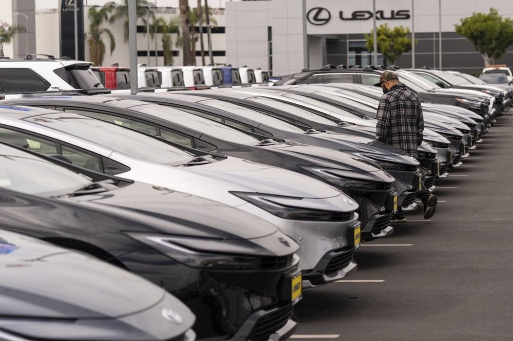 A person looks at a new vehicle at a Toyota dealership in El Monte, Calif., Thursday, March 27, 2025. (AP Photo/Jae C. Hong)