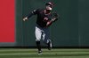 Cleveland Guardians' Tyler Freeman catches a fly out hit by Los Angeles Angels' Mike Trout during the first inning of a spring training baseball game, Wednesday, March 19, 2025, in Tempe, Ariz. (AP Photo/Matt York)