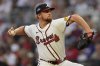 Atlanta Braves pitcher Spencer Schwellenbach (56) delivers against the Miami Marlins in the second inning of a home-opening baseball game, Friday, April 4, 2025, in Atlanta. (AP Photo/Mike Stewart)