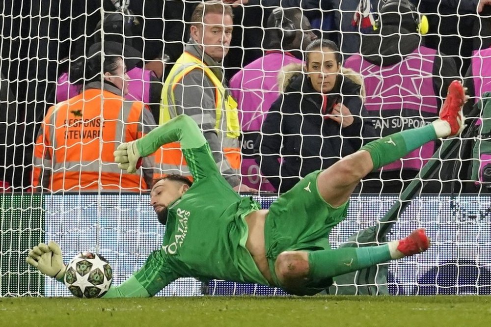 PSG's goalkeeper Gianluigi Donnarumma saves a penalty from Liverpool's Curtis Jones during a shootout at the end of the Champions League round of 16 second leg soccer match between Liverpool and Paris Saint-Germain at Anfield in Liverpool, England, Tuesday, March 11, 2025. (AP Photo/Dave Thompson)