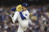 Los Angeles Dodgers pitcher Roki Sasaki throws to the plate during the second inning of a baseball game against the Detroit Tigers Saturday, March 29, 2025, in Los Angeles. (AP Photo/Mark J. Terrill)