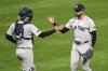 New York Yankees pitcher Devin Williams, right, celebrates with catcher Austin Wells, left, after getting the final out of a baseball game against the Pittsburgh Pirates in Pittsburgh, Friday, April 4, 2025. (AP Photo/Gene J. Puskar)