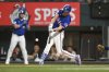 Texas Rangers' Evan Carter follows through on a swing in the eighth inning of an exhibition baseball game against the Kansas City Royals, Monday, March 24, 2025, Arlington, Texas. (AP Photo/Albert Pena)
