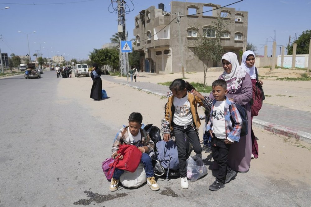 Displaced Palestinians, who flee from Rafah, arrive in Khan Younis, Gaza, on Monday, March 31, 2025, after the Israeli military issued sweeping evacuation orders covering most of Rafah. (AP Photo/Abdel Kareem Hana)