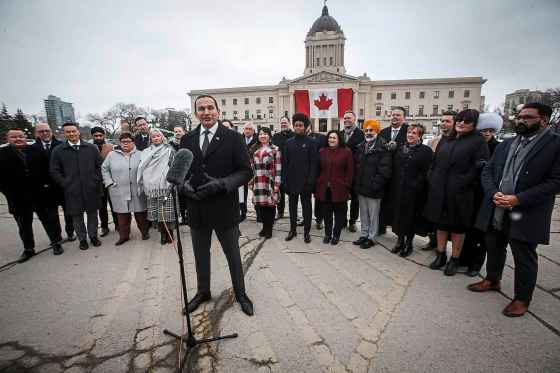 Premier Wab Kinew speaks to media about the government's response to U.S. government tariffs outside the Manitoba legislature Tuesday. (John Woods / Free Press)