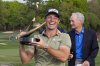 Viktor Hovland, of Norway, reacts as he hold the trophy after winning the Valspar Championship golf tournament Sunday, March 23, 2025, at Innisbrook in Palm Harbor, Fla. (AP Photo/Chris O'Meara)