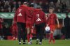 Bayern's Jamal Musiala is helped off the pitch during the German Bundesliga soccer match between Augsburg and Bayern Munich in Augsburg, Friday, April 4, 2025. (AP Photo/Matthias Schrader)