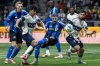 Vancouver Whitecaps' Mathias Laborda (2) prepares to kick the ball to score as Brian White (24), CF Montreal's Brandan Craig, left, and Joel Waterman (16) watch during the first half of an MLS soccer match in Vancouver, B.C., on Saturday, March 8, 2025. THE CANADIAN PRESS/Ethan Cairns
