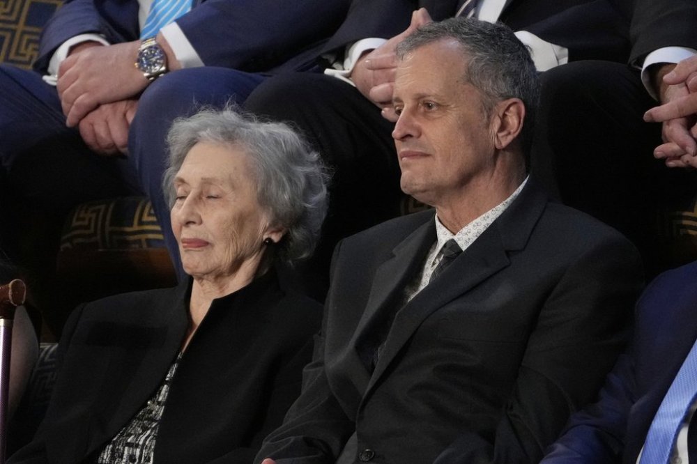 Former hostage Marc Fogel and his mother Malphine listen as President Donald Trump addresses a joint session of Congress in the House chamber at the U.S. Capitol in Washington, Tuesday, March 4, 2025. (AP Photo/Julia Demaree Nikhinson)