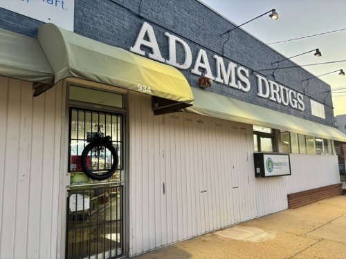 A black wreath hangs on the door of Adams Drugs in Montgomery, Ala., Feb. 25, 2025. (AP Photo/Kim Chandler)