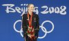FILE - Zimbabwe's Kirsty Coventry smiles after receiving her gold medal after the women's 200-meter backstroke final during the swimming competitions in the National Aquatics Center at the Beijing 2008 Olympics in Beijing, Saturday, Aug. 16, 2008. (AP Photo/Mark Baker, File)